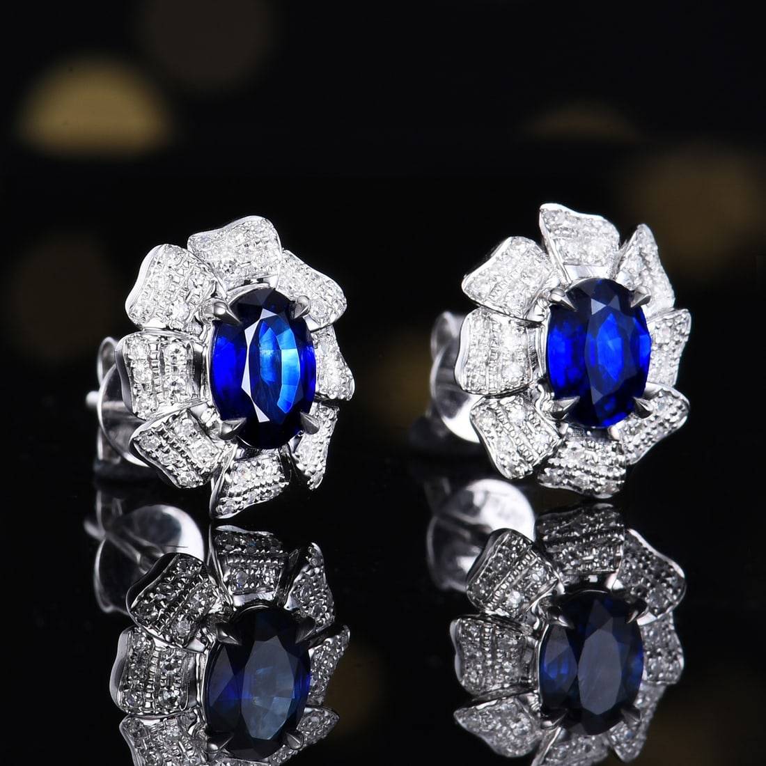 14k Gold 1.26 Ctw Natural Sapphire & Diamond Earrings: Ref:231156125 // gold content:14k gold // main gemstone:sapphire // shape:oval // carat weight:1. 06ct // color:blue // treatment:natural // // adjacent gemstone 2 : diamond // number of stones:80 //