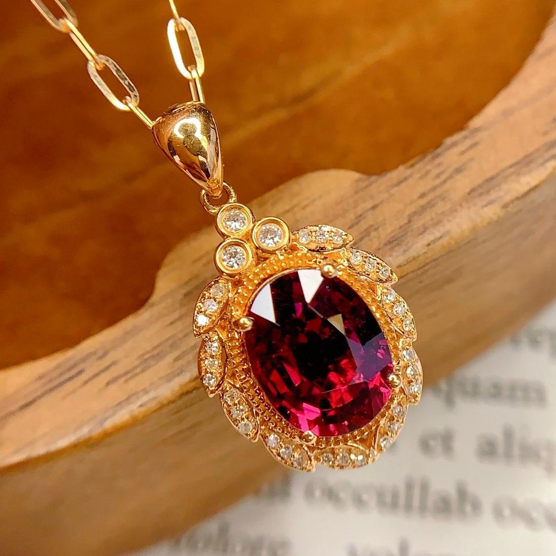 14k Gold 2 Ct Natural Tourmaline & Diamond Pendant( Without Chain ): Ref:231156142 // gold content:14k gold // main gemstone:tourmaline // shape:oval // carat weight:2ct // color:red // treatment:natural // // adjacent gemstone 2 : diamond // number of stones:33 //