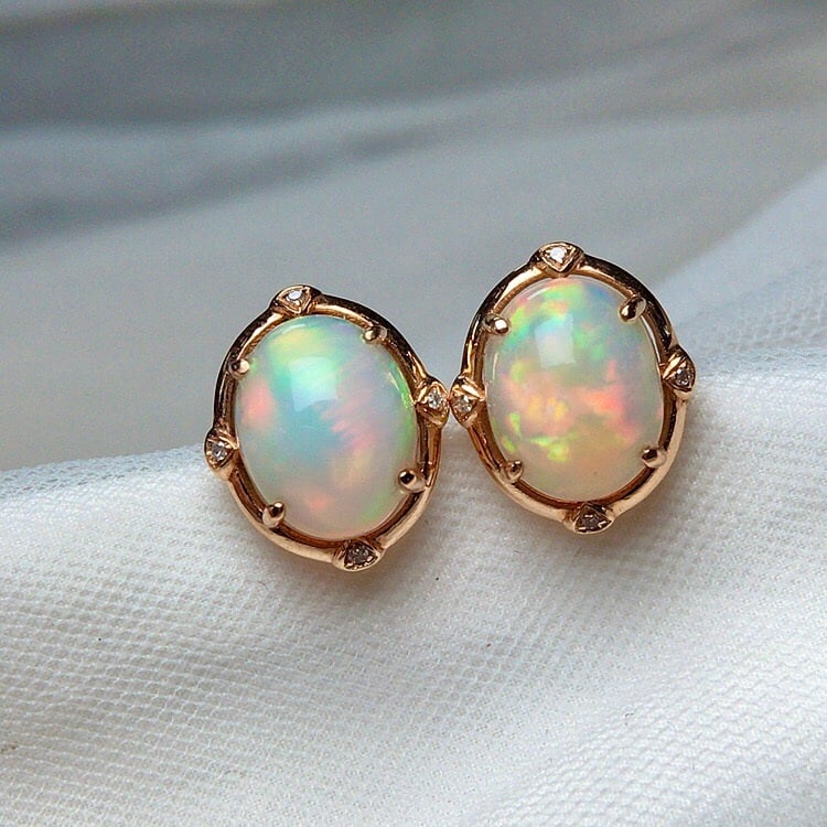 14k Gold 4.00 Ct Natural Opal & Diamond Earrings: Ref:231156255 // gold content:14k gold // main gemstone:opal // shape:oval // carat weight:4. 00ct // color:color // treatment:natural // // adjacent gemstone 2 : diamond // number of stones:8 //