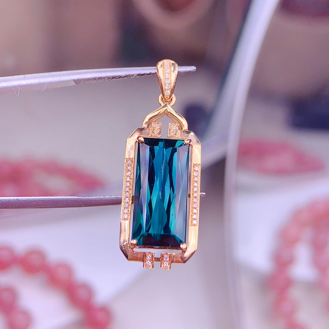 14k Gold 5.9 Ct Natural Tourmaline & Diamond Pendant( Without Chain ): Ref:231156275 // gold content:14k gold // main gemstone:tourmaline // shape:octagonal // carat weight:5. 9ct // color:blue // treatment:natural // // adjacent gemstone 2 : diamond // shape:round //