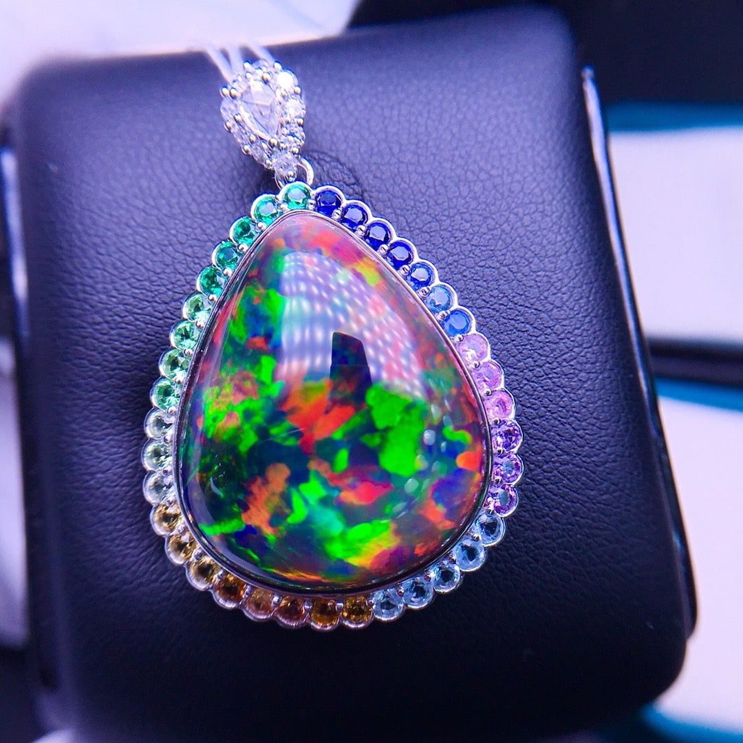 14k Gold 18.13 Ctw Natural Opal & Diamond Pendant( Without Chain ): Ref:231156305 // gold content:14k gold // main gemstone:opal // shape:pear // carat weight:17. 9ct // color:color // treatment:natural // // adjacent gemstone 2 : diamond // shape:round // carat weigh