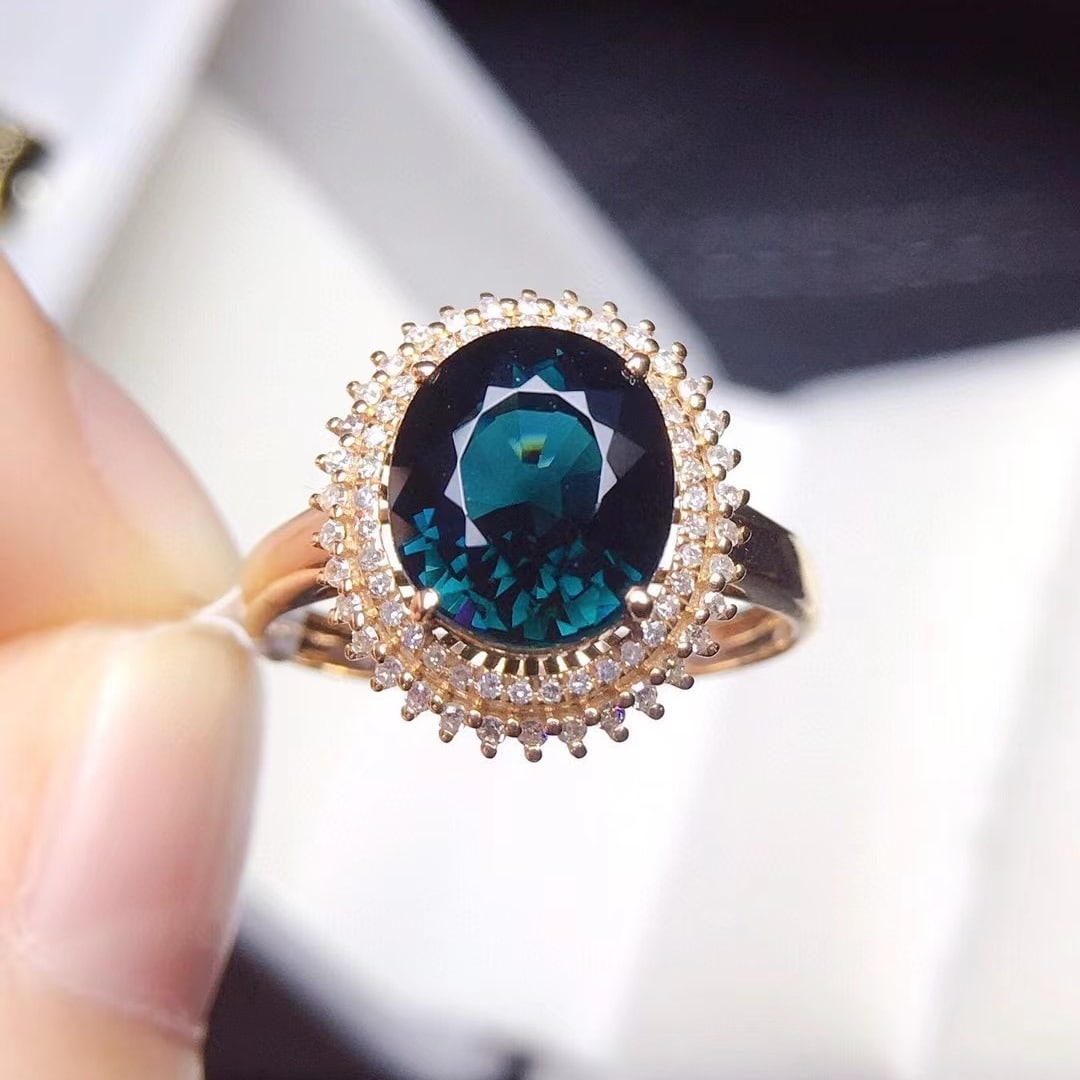 14k Gold 2.6 Ct Natural Tourmaline & Diamond Ring: Ref:231156404 // gold content:14k gold // ring size:7. 25us // // main gemstone:tourmaline // shape:oval // carat weight:2. 6ct // color:blue // treatment:natural // // adjacent gemstone 2 : diamond