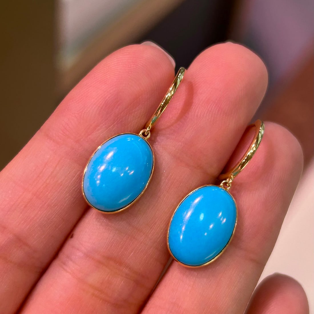 14k Gold 8.7 Ct Natural Blue Turquoise Earrings: Ref:231156411 // gold content:14k gold // main gemstone:blue turquoise // shape:oval // carat weight:8. 7ct // color:blue // treatment:natural // Condition: New Low Estimate: 3500.00 High Estimate: