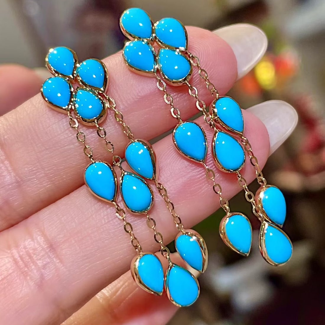 14k Gold 8.0 Ct Natural Blue Turquoise Earrings: Ref:231156450 // gold content:14k gold // main gemstone:blue turquoise // shape:pear // carat weight:8. 0ct // color:blue // treatment:natural // Condition: New Low Estimate: 4800.00 High Estimate: