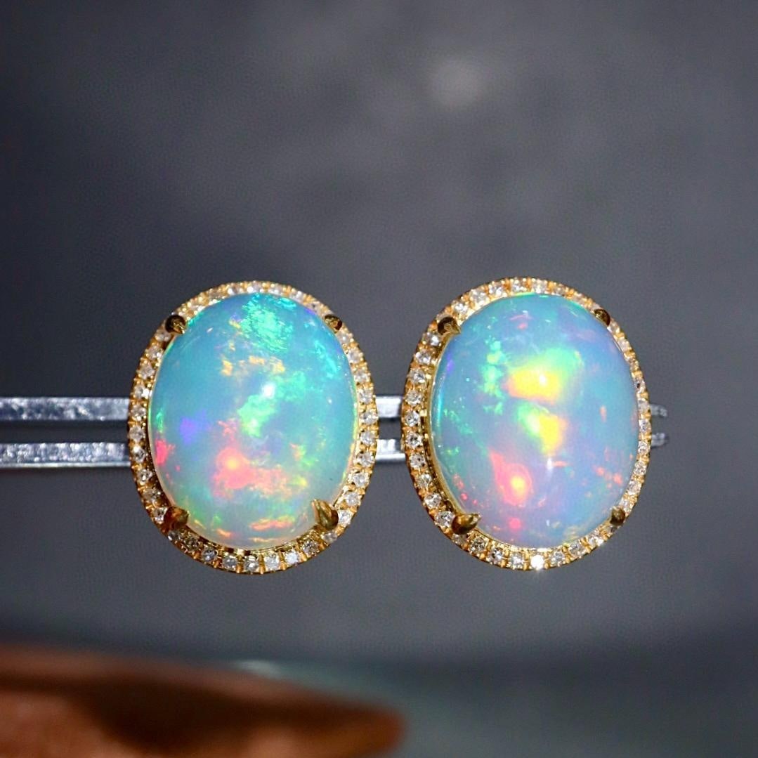 14k Gold 5.03 Ctw Natural Opal & Diamond Earrings: Ref:231157037 // gold content:14k gold // main gemstone:opal // shape:oval // carat weight:4. 8ct // color:color // treatment:natural // // adjacent gemstone 2 : diamond // shape:round // carat weight