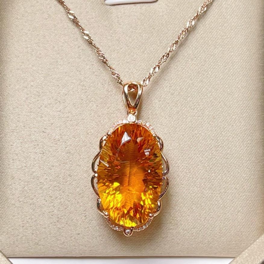 14k Gold 19.02 Ctw Natural Citrine & Diamond Pendant( Without Chain ): Ref:231157117 // gold content:14k gold // main gemstone:citrine // shape:oval // carat weight:18. 95ct // color:yellow // treatment:natural // // adjacent gemstone 2 : diamond // number of stones:22 /