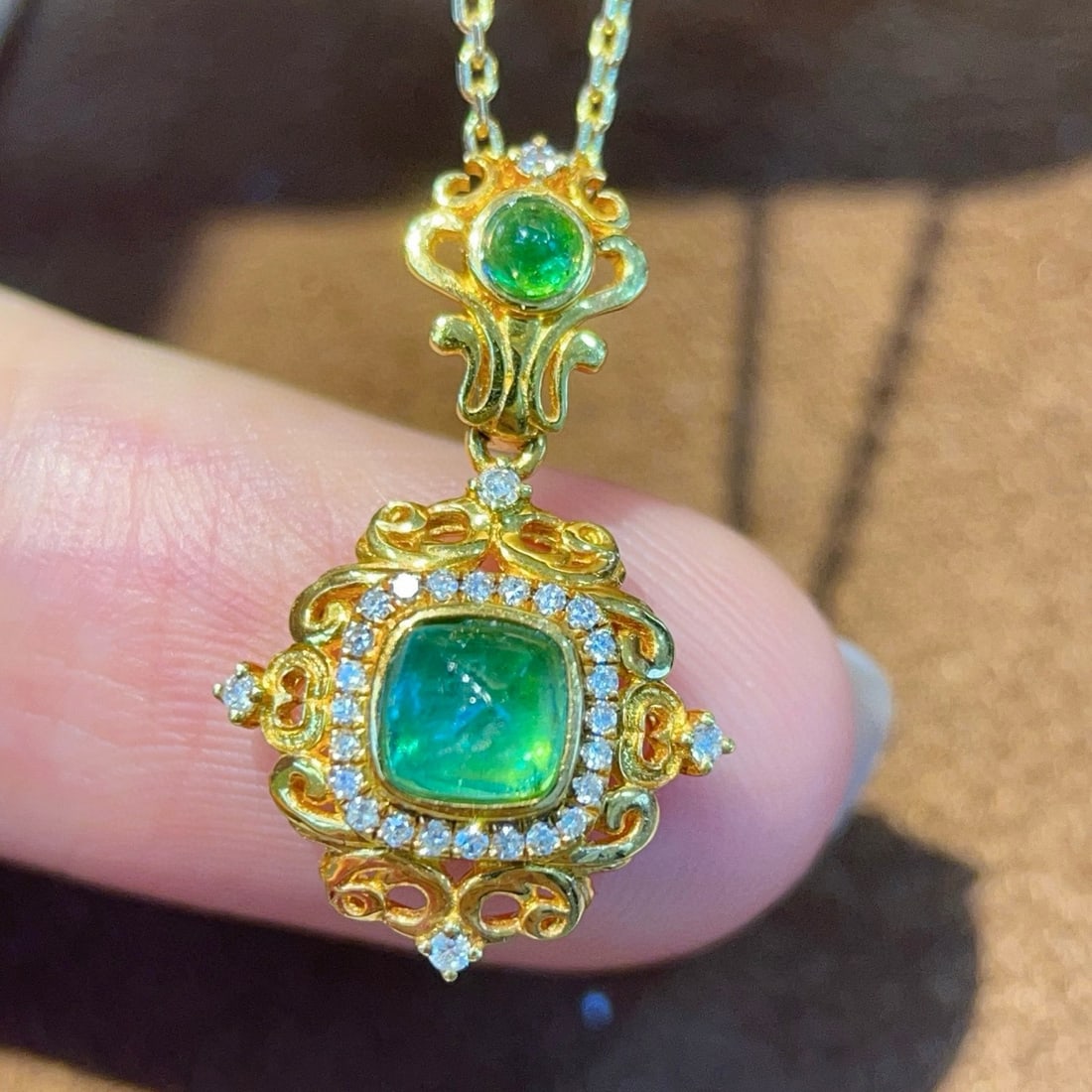 14k Gold 0.77 Ctw Natural Emerald & Diamond Pendant( Without Chain ): Ref:231157223 // gold content:14k gold // main gemstone:emerald // number of stones:2 // shape:sugar-loaf & round // carat weight:0. 65ct // color:green // treatment:natural // // adjacent gemstone 2