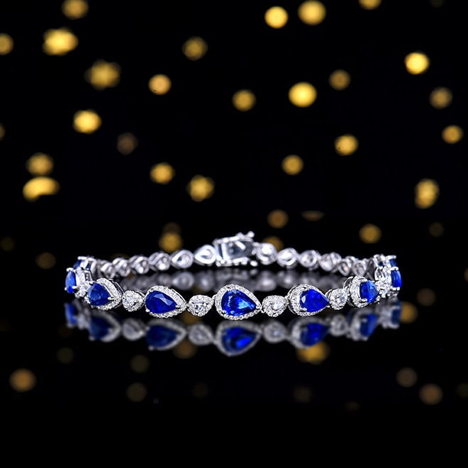 14k Gold 4.81 Ctw Natural Sapphire & Diamond Bracelet: Ref:231158010 // gold content:14k gold // main gemstone:sapphire // shape:pear // carat weight:3. 73ct // color:blue // treatment:natural // // adjacent gemstone 2 : diamond // shape:round // carat we