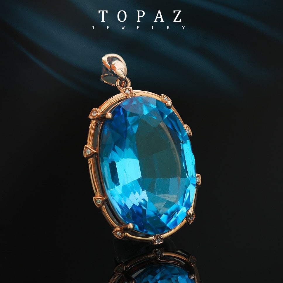 14k Gold 23.33 Ctw Natural Topaz & Diamond Pendant( Without Chain ): Ref:231158028 // gold content:14k gold // main gemstone:topaz // shape:oval // carat weight:23. 3ct // color:blue // treatment:natural // // adjacent gemstone 2 : diamond // number of stones:10 //