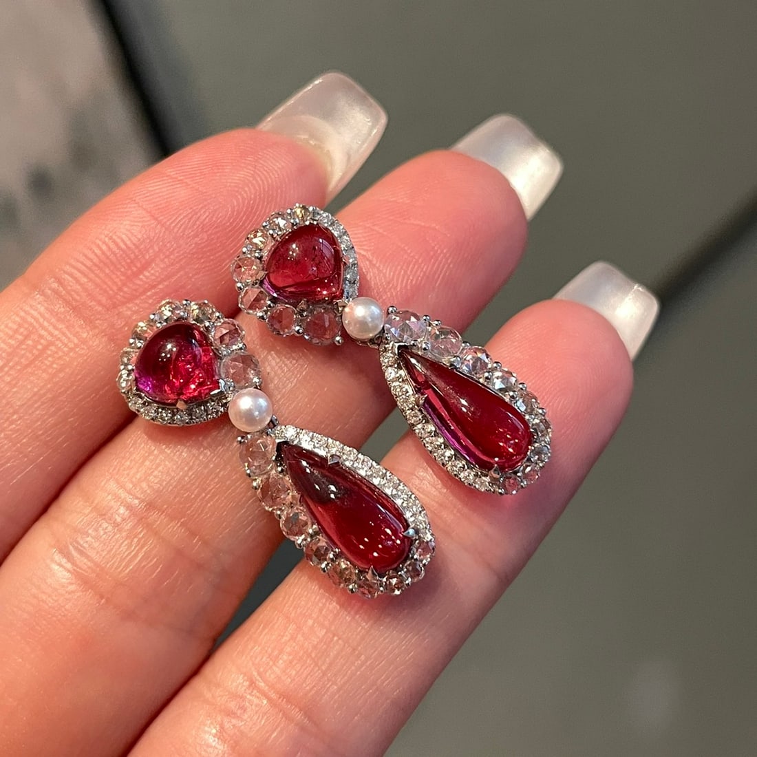 14k Gold 4.6 Ct Natural Tourmaline & Diamond & Sapphire Earrings: Ref:231158203 // gold content:14k gold // main gemstone:tourmaline // shape:pear // carat weight:4. 6ct // color:red // treatment:natural // // adjacent gemstone 2 : diamond // shape:round // clarity 