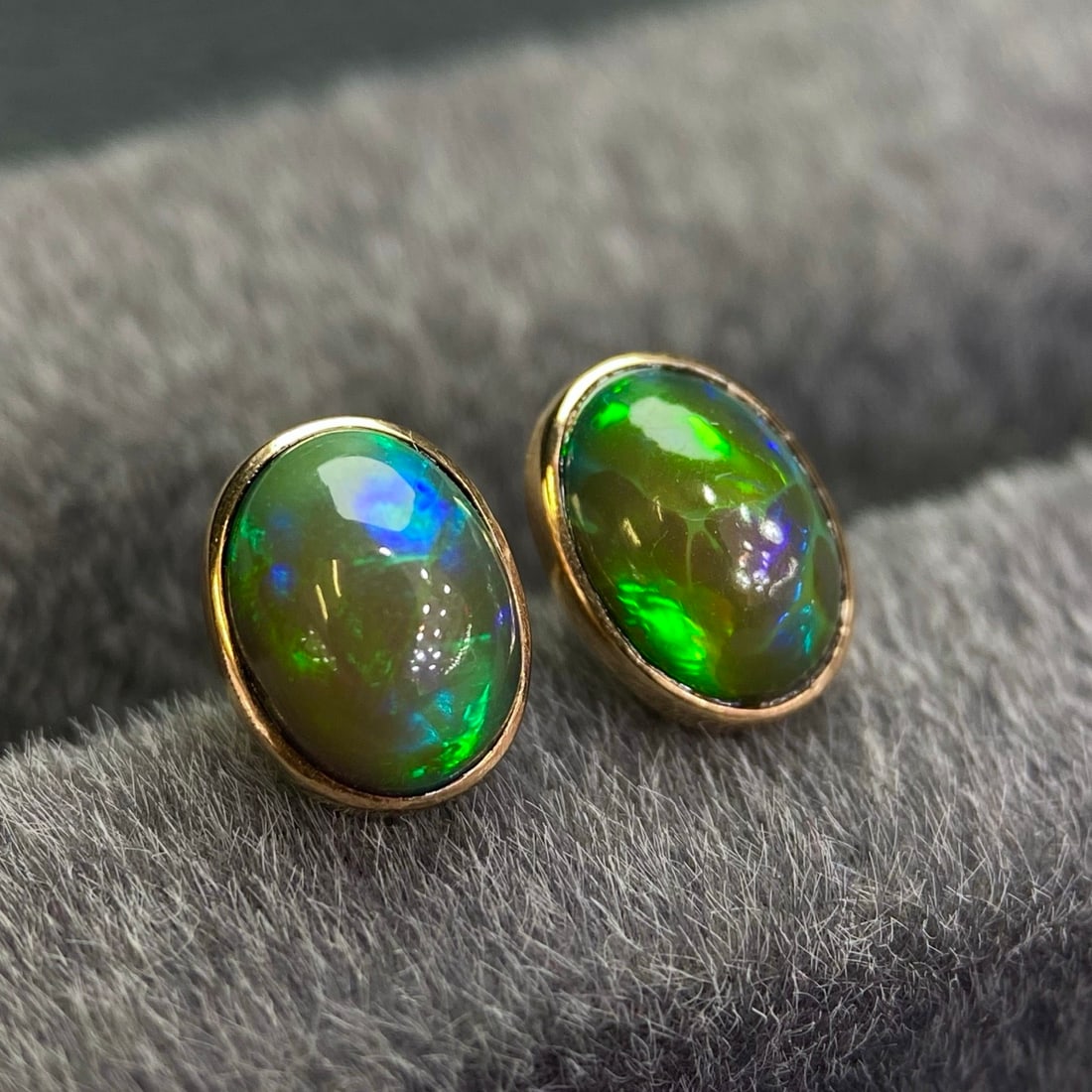 14k Gold 1.68 Ct Natural Opal Earrings: Ref:231158266 // gold content:14k gold // main gemstone:opal // shape:oval // carat weight:1. 68ct // color:color // treatment:natural // Condition: New Low Estimate: 1400.00 High Estimate: 2100.00
