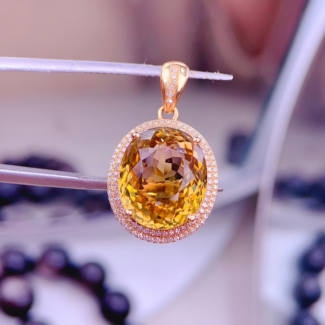 14k Gold 8.6 Ct Natural Tourmaline & Diamond Pendant( Without Chain ): Ref:231158373 // gold content:14k gold // main gemstone:tourmaline // shape:oval // carat weight:8. 6ct // color:yellow // treatment:natural // // adjacent gemstone 2 : diamond // shape:round //
