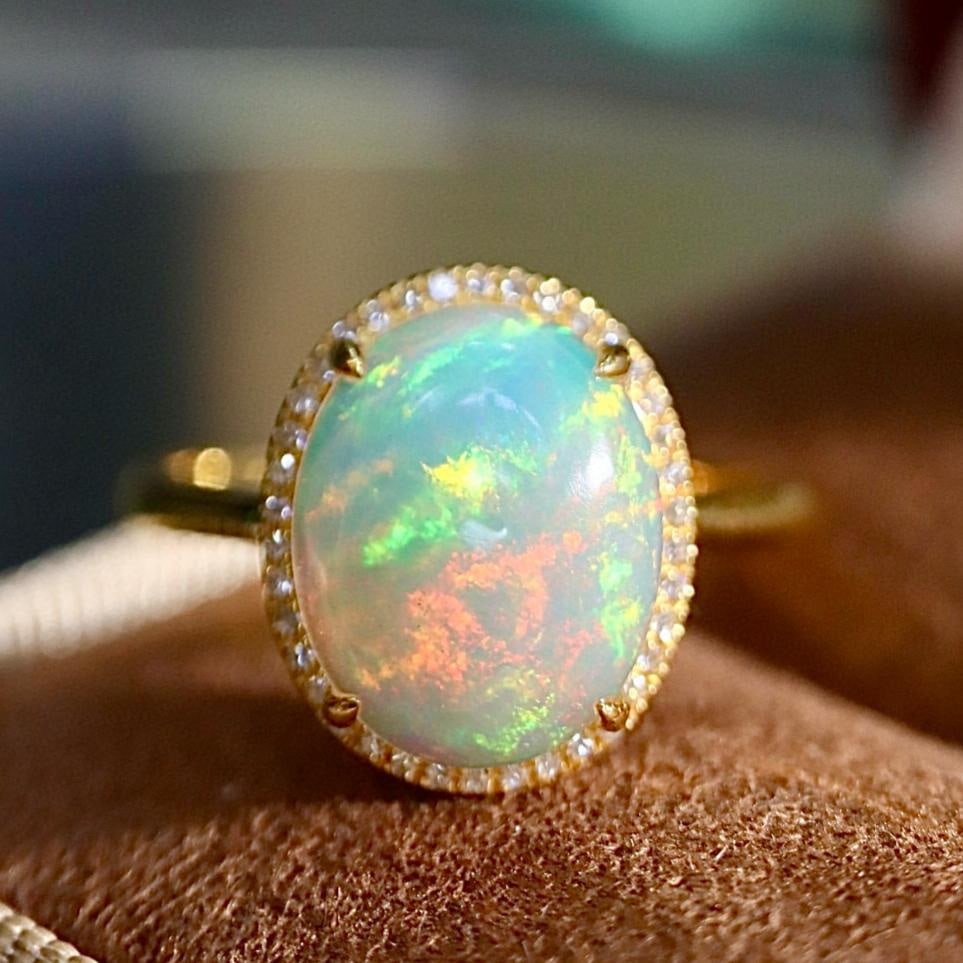 14k Gold 2.21 Ctw Natural Opal & Diamond Ring: Ref:231159086 // gold content:14k gold // ring size:7. 25us // // main gemstone:opal // shape:oval // carat weight:2. 1ct // color:color // treatment:natural // // adjacent gemstone 2 : diamond // sha
