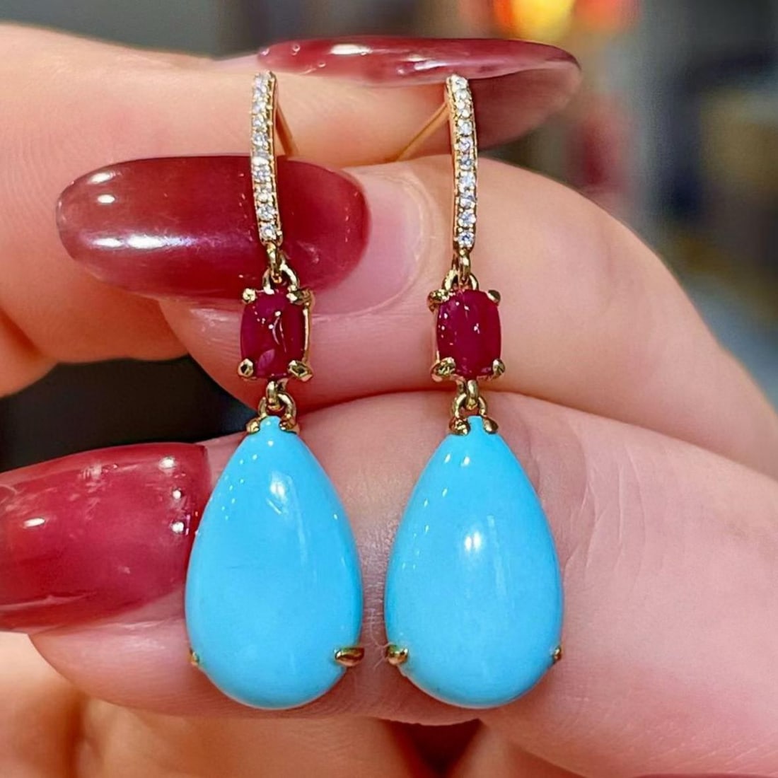 14k Gold 5.41 Ctw Natural Blue Turquoise & Ruby Earrings: Ref:231159112 // gold content:14k gold // main gemstone:blue turquoise // shape:pear // carat weight:4. 98ct // color:blue // treatment:natural // // adjacent gemstone 2 : ruby // shape:sugar-loaf // 