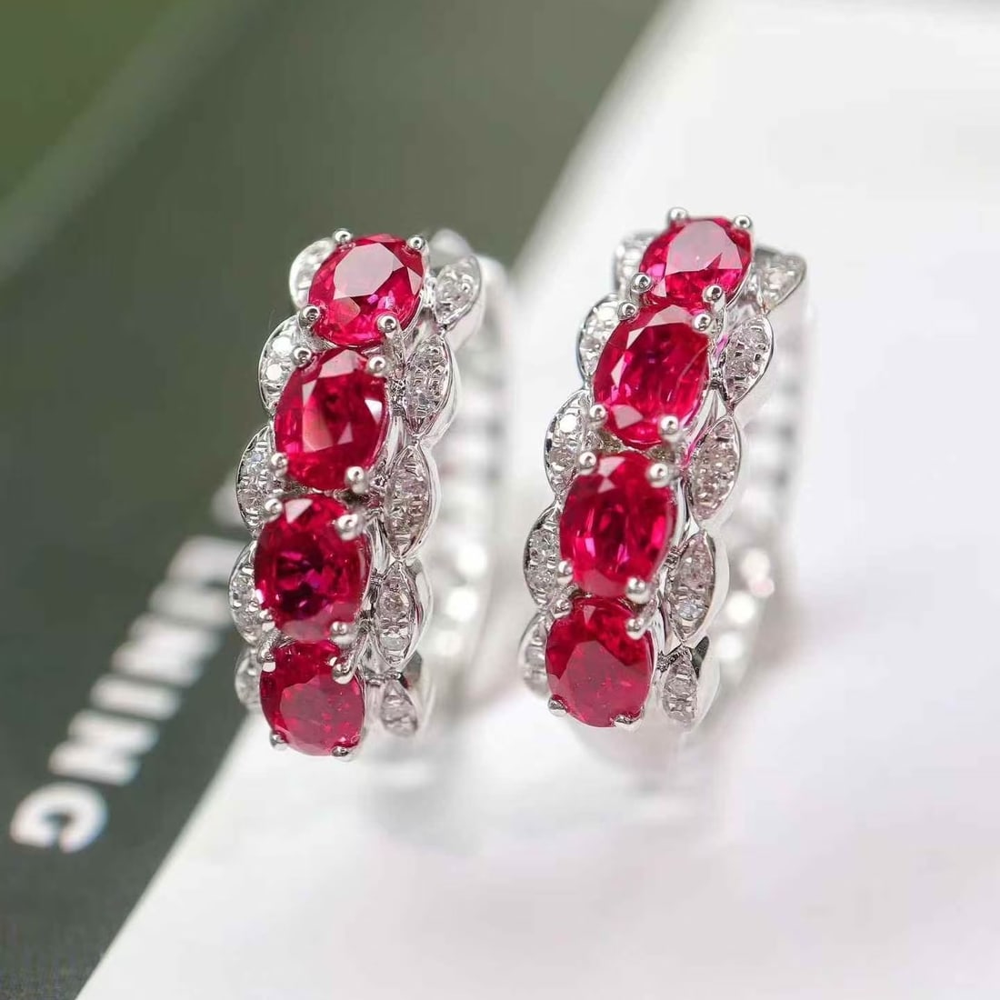 14k Gold 2.40 Ctw Natural Ruby & Diamond Earrings: Ref:231160079 // gold content:14k gold // main gemstone:ruby // shape:oval // carat weight:2. 28ct // color:red // treatment:natural // // adjacent gemstone 2 : diamond // shape:round // carat