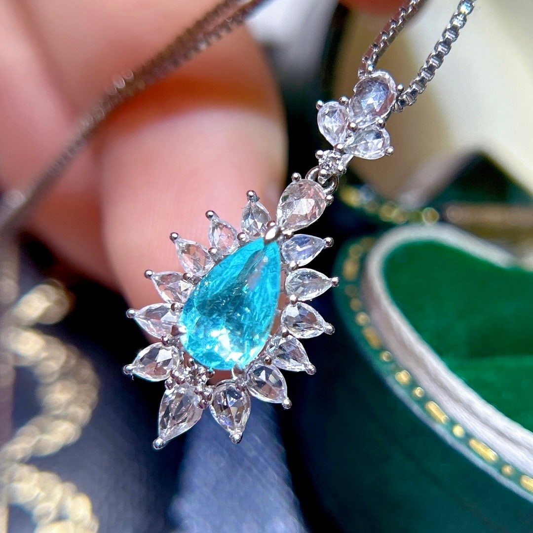 14k Gold 1.73 Ctw Natural Paraiba Tourmaline & Sapphire Pendant( Without Chain ): Ref:231160152 // gold content:14k gold // main gemstone:paraiba tourmaline // shape:pear // carat weight:0. 73ct // color:blue // treatment:natural // // adjacent gemstone 2 : sapphire // shape:pear