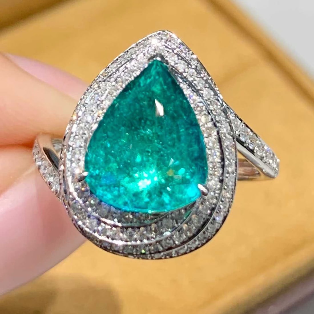 14k Gold 2.7 Ct Natural Paraiba Tourmaline & Diamond Ring: Ref:231160287 // gold content:14k gold // ring size:7. 25us // // main gemstone:paraiba tourmaline // shape:pear // carat weight:2. 7ct // color:neon green // treatment:natural // // adjacent