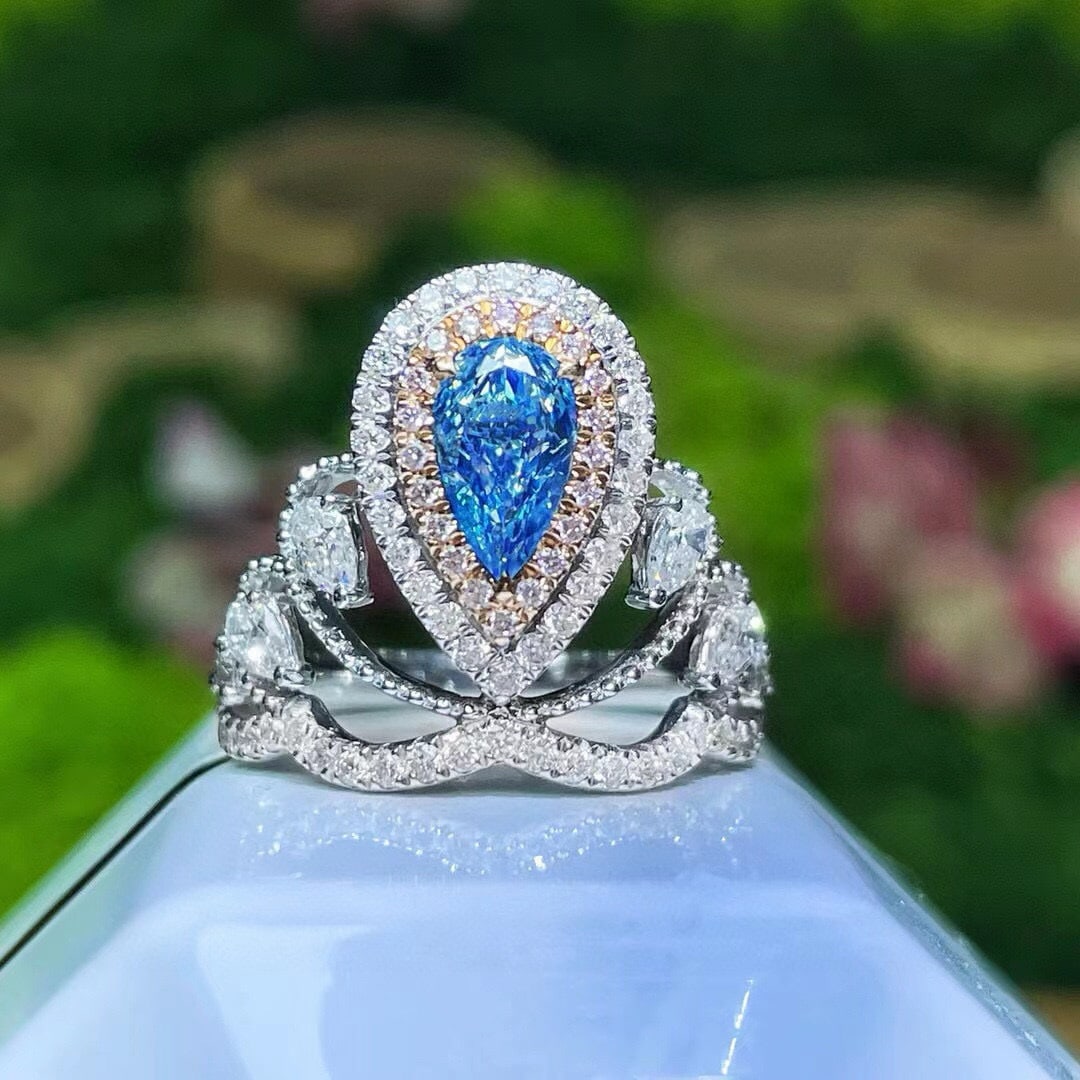 14k Gold 1.64 Ctw Natural Blue Diamond & Diamond Ring: Ref:231153050 // gold content:14k gold // ring size:7. 25us // // main gemstone:blue diamond // shape:pear // carat weight:0. 72ct // color:blue // treatment:natural // // adjacent gemstone 2 :