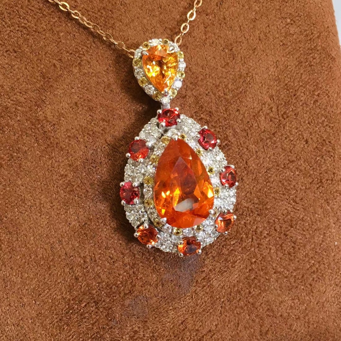 14k Gold 6.43 Ctw Natural Spessartine & Diamond Pendant( Without Chain ): Ref:231153157 // gold content:14k gold // main gemstone:spessartine // shape:pear // carat weight:5. 8ct // color:orange // treatment:natural // // adjacent gemstone 2 : diamond // shape:round // cara