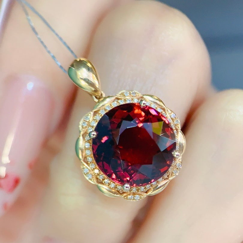 14k Gold 7.90 Ctw Natural Tourmaline & Diamond Pendant( Without Chain ): Ref:231154181 // gold content:14k gold // main gemstone:tourmaline // shape:round // carat weight:7. 75ct // color:red // treatment:natural // cut grade:g // // adjacent gemstone 2 : diamond //