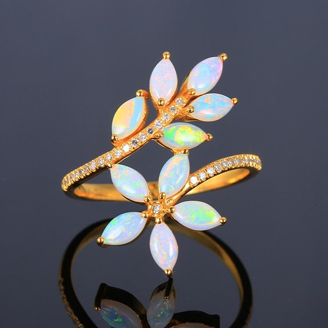 14k Gold 1.3 Ctw Natural Opal & Diamond Ring: Ref:231154238 // gold content:14k gold // ring size:7. 25us // // main gemstone:opal // shape:marquise // carat weight:1. 2ct // color:color // treatment:natural // // adjacent gemstone 2 : diamond