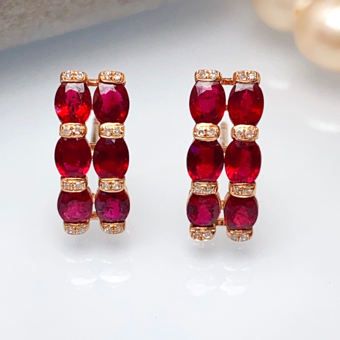 14k Gold 2.30 Ct Natural Ruby & Diamond Earrings: Ref:231154274 // gold content:14k gold // main gemstone:ruby // shape:oval // carat weight:2. 30ct // color:red // treatment:natural // // adjacent gemstone 2 : diamond // number of stones:26 //
