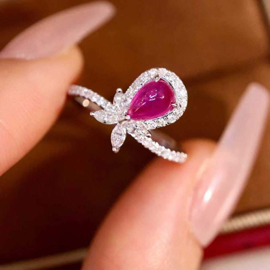 14k Gold 1.17 Ctw Natural Ruby & Diamond Ring: Ref:231154354 // gold content:14k gold // ring size:7. 25us // // main gemstone:ruby // shape:pear // carat weight:0. 83ct // color:red // treatment:natural // // adjacent gemstone 2 : diamond //