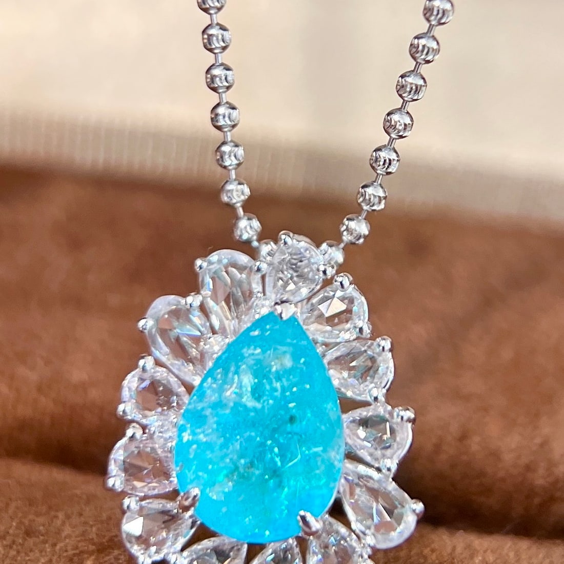 14k Gold 4.54 Ctw Natural Paraiba Tourmaline & Sapphire Pendant( Without Chain ): Ref:231154392 // gold content:14k gold // main gemstone:paraiba tourmaline // shape:pear // carat weight:3. 13ct // color:blue // treatment:natural // // adjacent gemstone 2 : sapphire // shape:pear