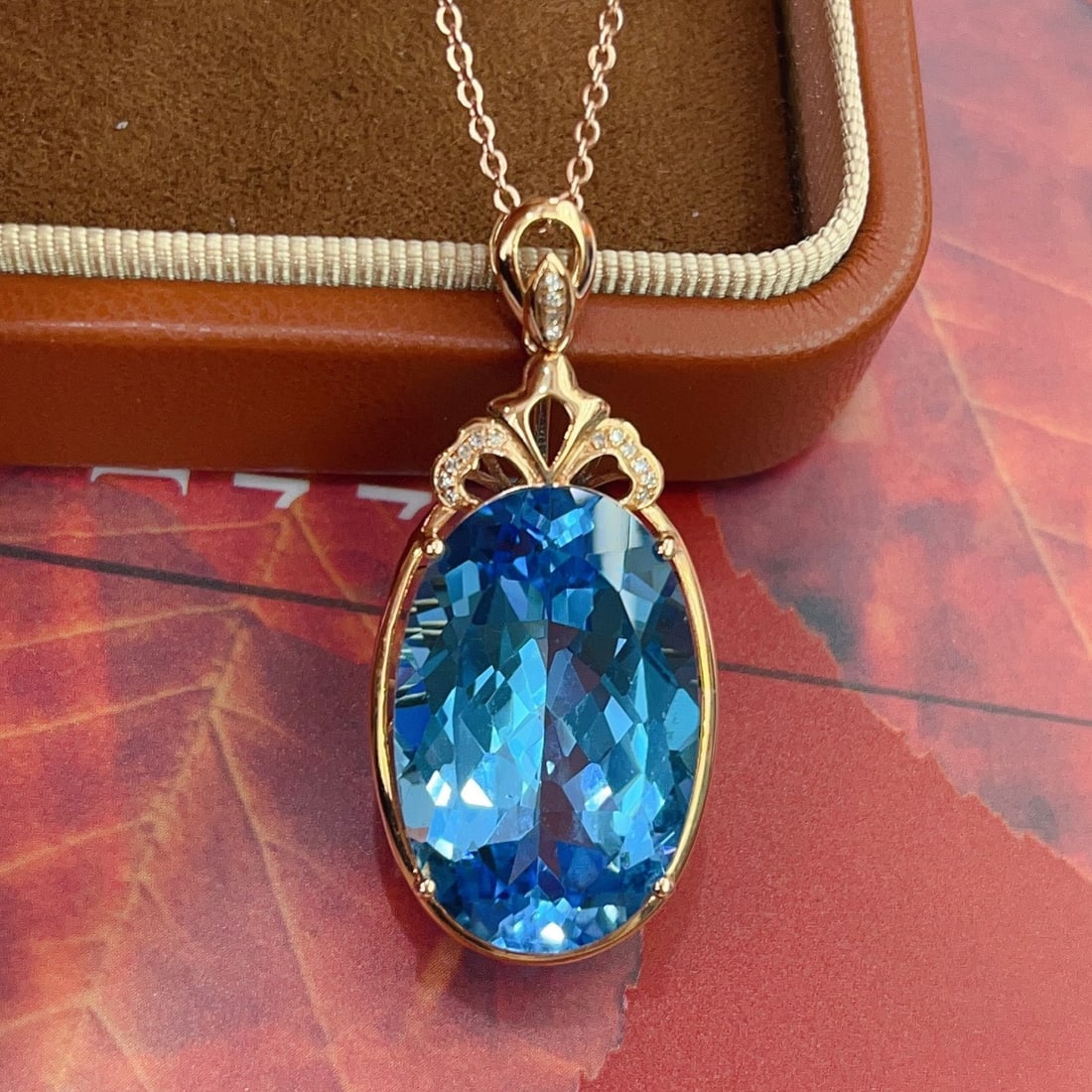 14k Gold 25.20 Ct Natural Topaz & Diamond Pendant( Without Chain ): Ref:231154396 // gold content:14k gold // main gemstone:topaz // shape:oval // carat weight:25. 20ct // color:blue // treatment:natural // // adjacent gemstone 2 : diamond // number of stones:16 //