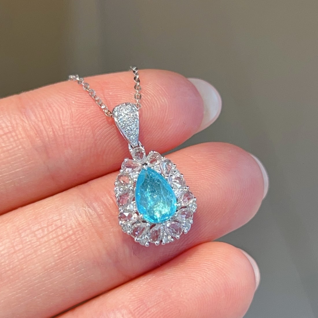 14k Gold 0.6 Ct Natural Paraiba Tourmaline & Sapphire & Diamond Pendant( Without Chain ): Ref:231154445 // gold content:14k gold // main gemstone:paraiba tourmaline // shape:pear // carat weight:0. 6ct // color:blue // treatment:natural // // adjacent gemstone 2 : sapphire // shape:pear