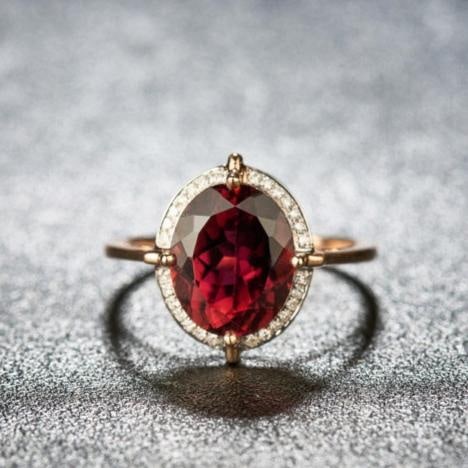 14k Gold 3.55 Ct Natural Tourmaline & Diamond Ring: Ref:231161064 // gold content:14k gold // ring size:7. 25us // // main gemstone:tourmaline // shape:oval // carat weight:3. 55ct // color:red // treatment:natural // // adjacent gemstone 2 : diamond