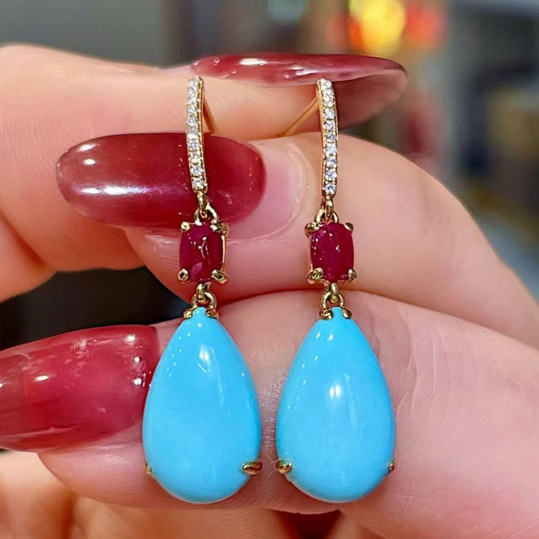 14k Gold 5.41 Ctw Natural Blue Turquoise & Ruby Earrings: Ref:231161068 // gold content:14k gold // main gemstone:blue turquoise // shape:pear // carat weight:4. 98ct // color:blue // treatment:natural // // adjacent gemstone 2 : ruby // shape:sugar-loaf //