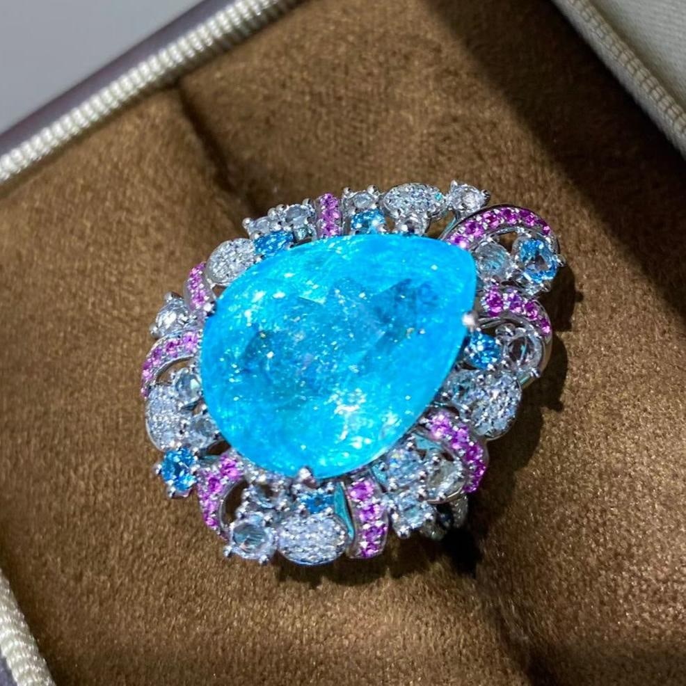 14k Gold 11 Ct Natural Paraiba Tourmaline & Diamond Ring: Ref:231161115 // gold content:14k gold // ring size:7. 25us // // main gemstone:paraiba tourmaline // shape:pear // carat weight:11ct // color:blue // treatment:natural // // adjacent gemstone 2 :