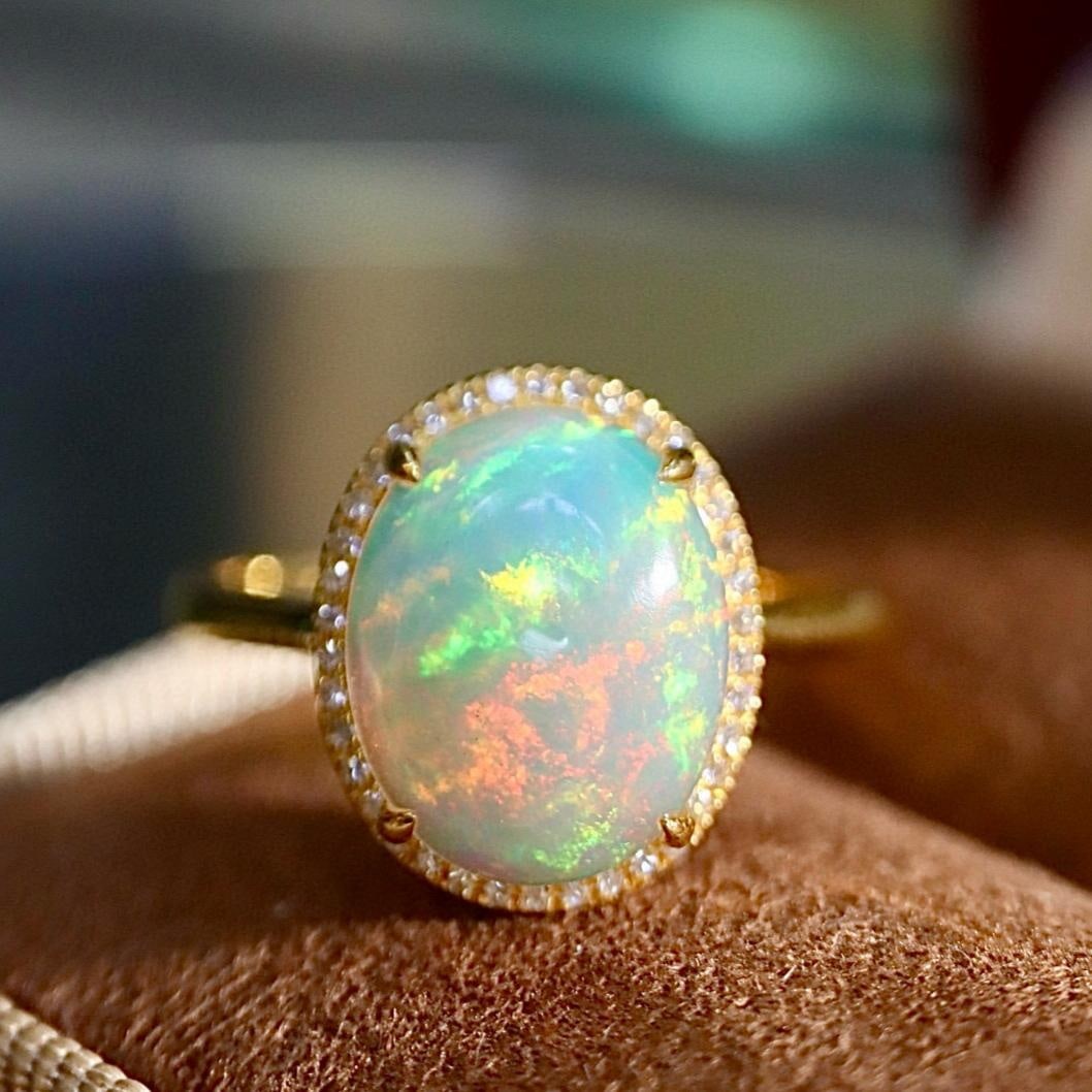 14k Gold 2.21 Ctw Natural Opal & Diamond Ring: Ref:231161136 // gold content:14k gold // ring size:7. 25us // // main gemstone:opal // shape:oval // carat weight:2. 1ct // color:color // treatment:natural // // adjacent gemstone 2 : diamond // sha