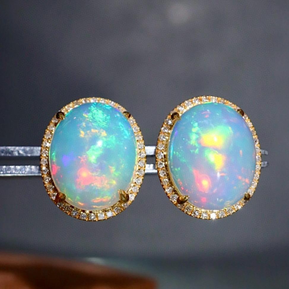 14k Gold 5.03 Ctw Natural Opal & Diamond Earrings: Ref:231161137 // gold content:14k gold // main gemstone:opal // shape:oval // carat weight:4. 8ct // color:color // treatment:natural // // adjacent gemstone 2 : diamond // shape:round // carat