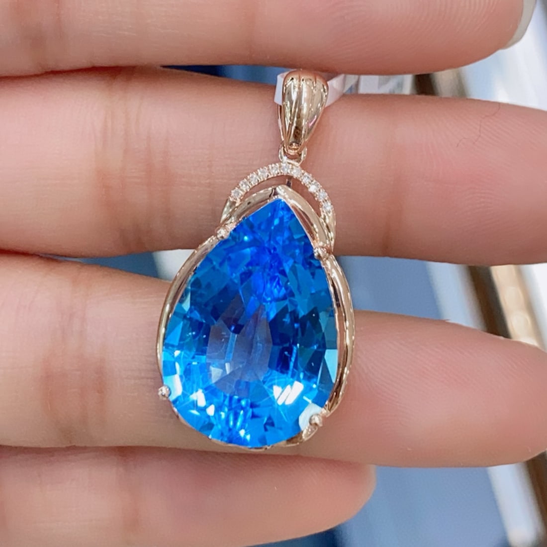 14k Gold 15.03 Ctw Natural Topaz & Diamond Pendant( Without Chain ): Ref:231161248 // gold content:14k gold // main gemstone:topaz // shape:pear // carat weight:15ct // color:blue // treatment:natural // // adjacent gemstone 2 : diamond // number of stones:11 //