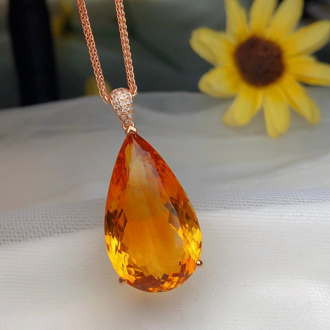 14k Gold 22.80 Ct Natural Citrine & Diamond Pendant( Without Chain ): Ref:231162129 // gold content:14k gold // main gemstone:citrine // shape:pear // carat weight:22. 80ct // color:yellow // treatment:natural // // adjacent gemstone 2 : diamond // number of stones:17 /