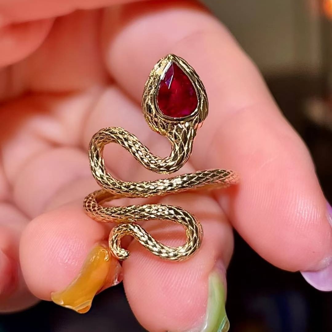 14k Gold 0.7 Ct Natural Ruby & Snake Ring: Ref:231162138 // gold content:14k gold // ring size:7. 25us // // main gemstone:ruby // shape:pear // carat weight:0. 7ct // color:red // treatment:natural // High Estimate: 5300 Low Estimate: 3500