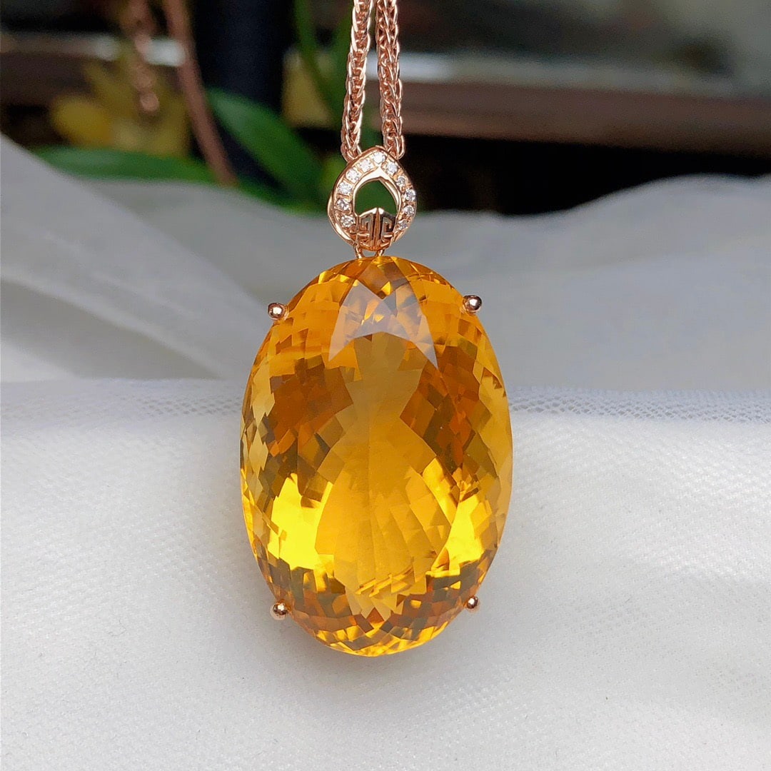 14k Gold 31.80 Ct Natural Citrine & Diamond Pendant( Without Chain ): Ref:231162161 // gold content:14k gold // main gemstone:citrine // shape:oval // carat weight:31. 80ct // color:yellow // treatment:natural // // adjacent gemstone 2 : diamond // number of stones:11 /