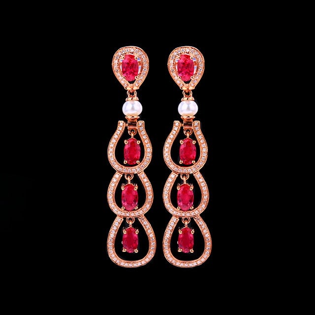 14k Gold 3.11 Ctw Natural Ruby & Diamond Earrings: Ref:231162241 // gold content:14k gold // main gemstone:ruby // shape:oval // carat weight:2. 5ct // color:red // treatment:natural // // adjacent gemstone 2 : diamond // number of stones:204 //