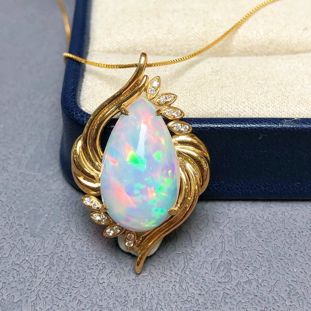 14k Gold 10.36 Ctw Natural Opal & Diamond Pendant( Without Chain ): Ref:231162270 // gold content:14k gold // main gemstone:opal // shape:pear // carat weight:10. 25ct // color:color // treatment:natural // // adjacent gemstone 2 : diamond // shape:round // carat
