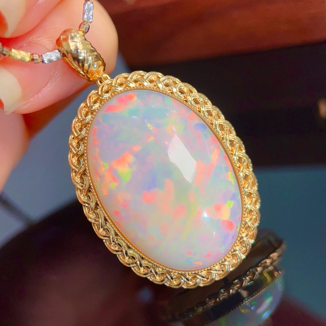 14k Gold 30.32 Ct Natural Opal Pendant( Without Chain ): Ref:231162407 // gold content:14k gold // main gemstone:opal // shape:oval // carat weight:30. 32ct // color:color // treatment:natural // Condition: New Low Estimate: 6800 High Estimate: 10000