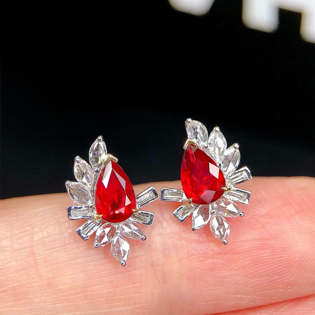 14k Gold 1.94 Ctw Natural Ruby & Diamond Earrings: Ref:231162443 // gold content:14k gold // main gemstone:ruby // shape:pear // carat weight:1. 41ct // color:pigeonblood red // treatment:natural // // adjacent gemstone 2 : diamond // shape:multiple /