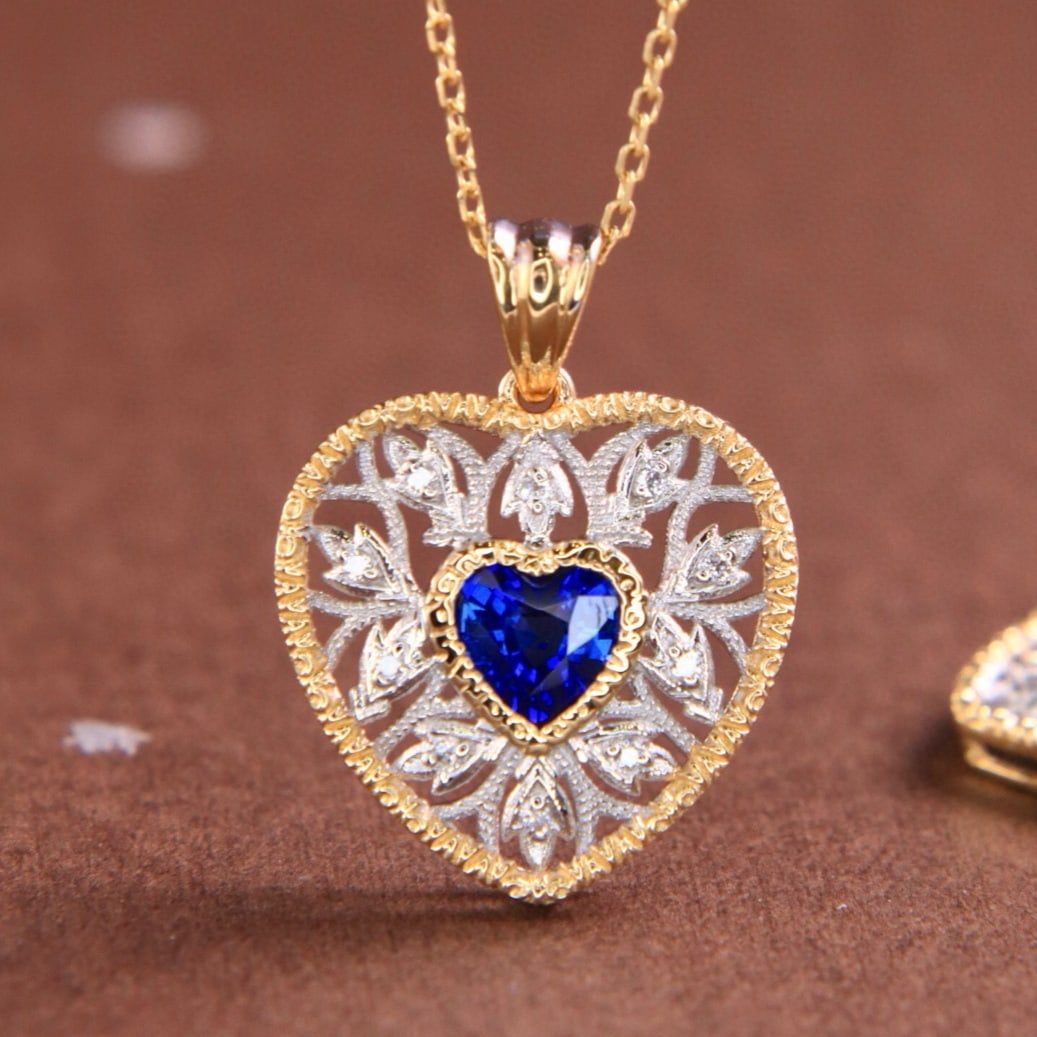 14k Gold 0.60 Ctw Natural Sapphire & Diamond Pendant( Without Chain ): Ref:231163078 // gold content:14k gold // main gemstone:sapphire // shape:heart // carat weight:0. 56ct // color:blue // treatment:natural // // adjacent gemstone 2 : diamond // shape:round // carat