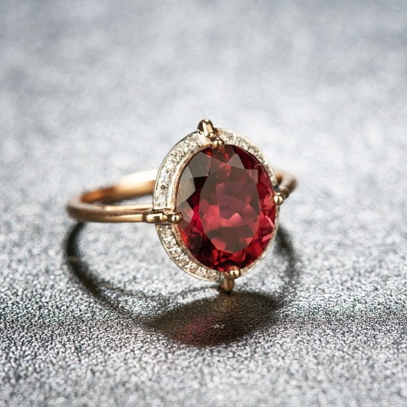 14k Gold 3.55 Ct Natural Tourmaline & Diamond Ring: Ref:231163112 // gold content:14k gold // ring size:7. 25us // // main gemstone:tourmaline // shape:oval // carat weight:3. 55ct // color:purplish red // treatment:natural // // adjacent gemstone 2 : 