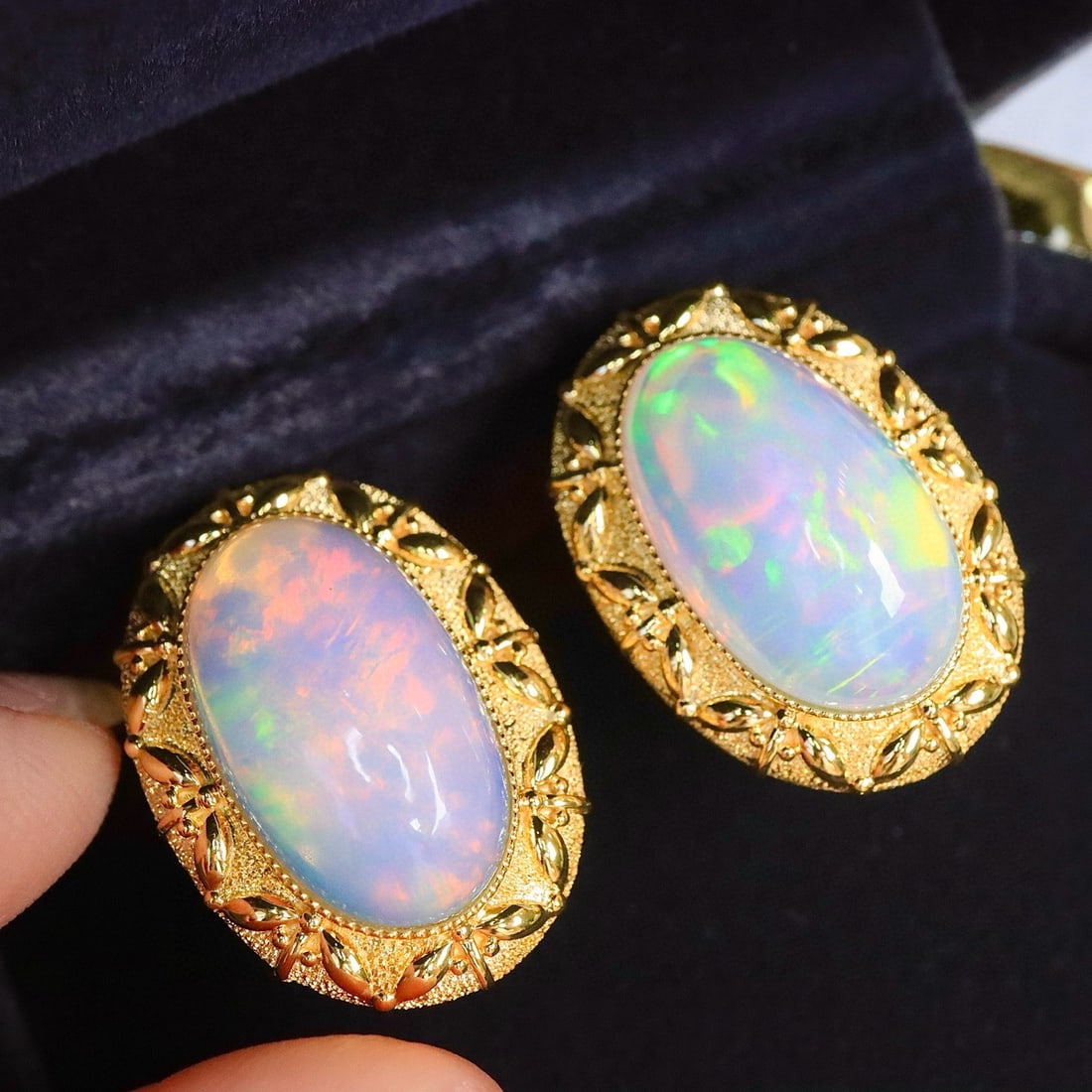 14k Gold 12.16 Ct Natural Opal Earrings: Ref:231163231 // gold content:14k gold // main gemstone:opal // shape:oval // carat weight:12. 16ct // color:color // treatment:natural // Low Estimate: 9200 Condition: New High Estimate: 14000