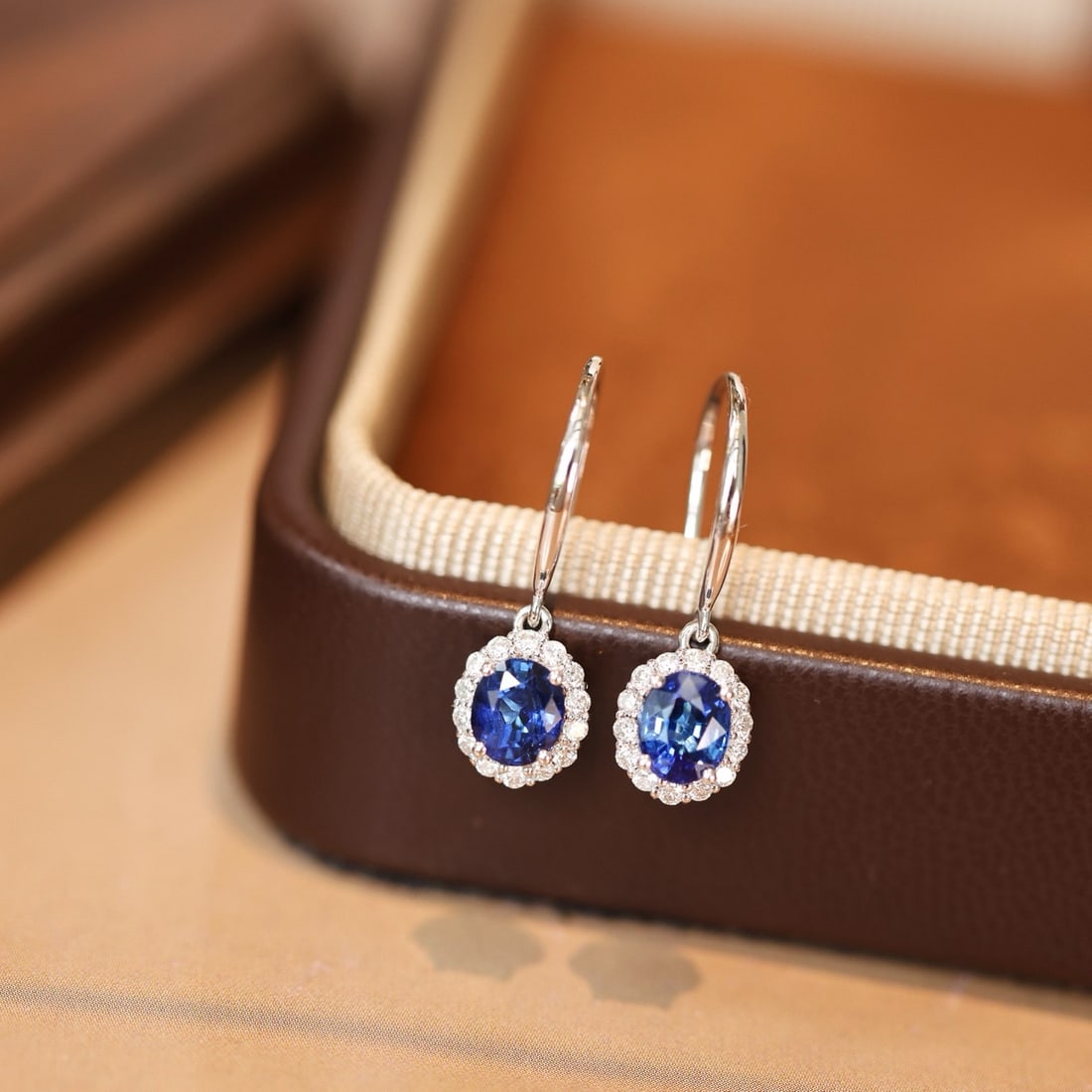 14k Gold 1.30 Ctw Natural Sapphire & Diamond Earrings: Ref:231164124 // gold content:14k gold // main gemstone:sapphire // shape:oval // carat weight:1. 08ct // color:blue // treatment:natural // // adjacent gemstone 2 : diamond // shape:round // carat