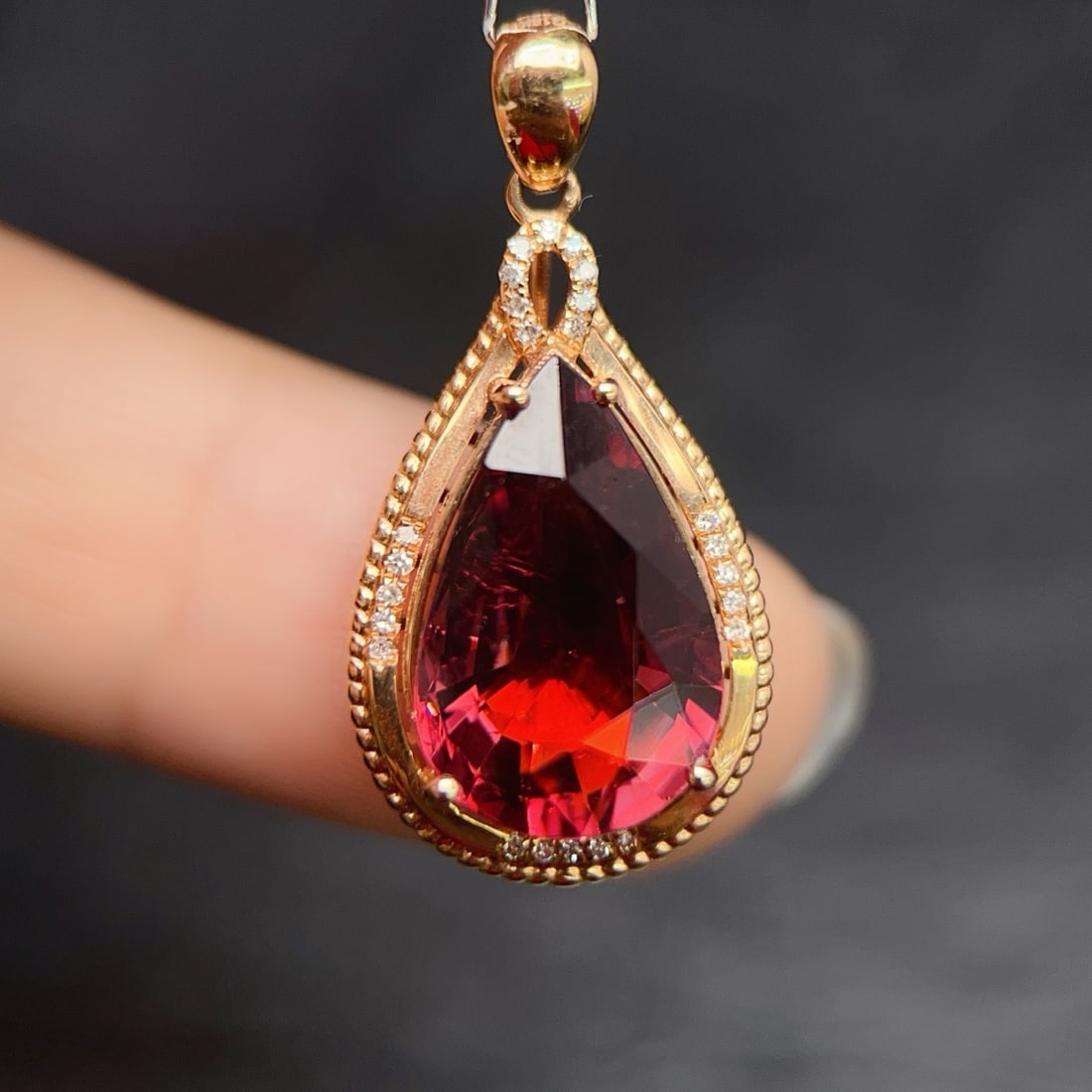 14k Gold 6.37 Ctw Natural Tourmaline & Diamond Pendant( Without Chain ): Ref:231164156 // gold content:14k gold // main gemstone:tourmaline // shape:pear // carat weight:5. 65ct // color:red // treatment:natural // // adjacent gemstone 2 : diamond // number of stones:24 //