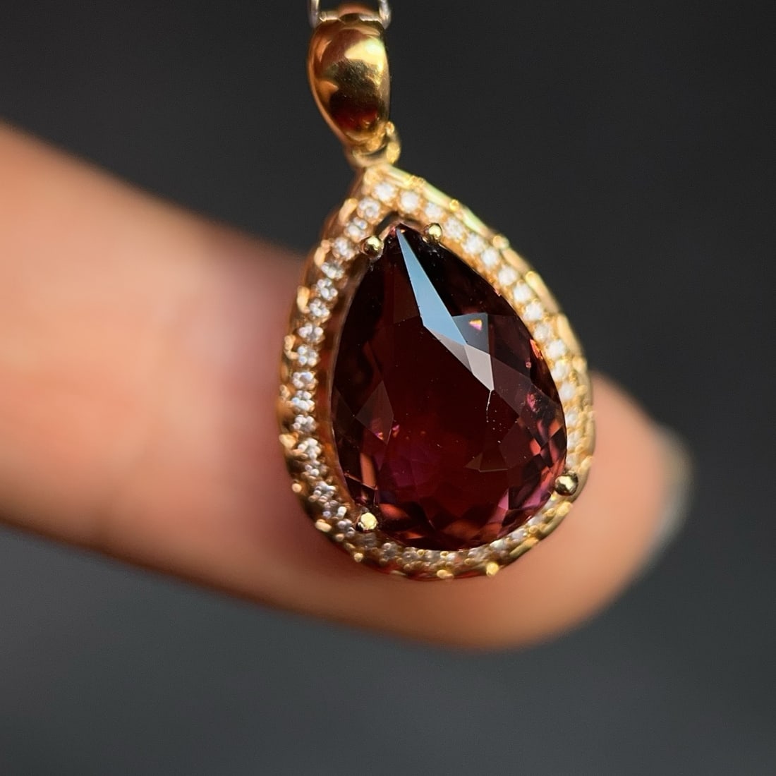 14k Gold 6.48 Ctw Natural Tourmaline & Diamond Pendant( Without Chain ): Ref:231164205 // gold content:14k gold // main gemstone:tourmaline // shape:pear // carat weight:6. 35ct // color:red // treatment:natural // // adjacent gemstone 2 : diamond // number of stones:43 //