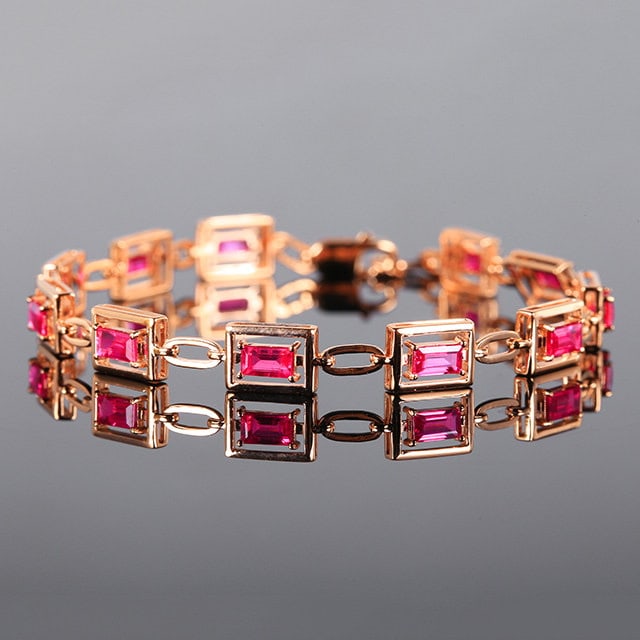 14k Gold 3.35 Ct Natural Ruby Bracelet: Ref:231164235 // gold content:14k gold // main gemstone:ruby // shape:rectangle // carat weight:3. 35ct // color:red // treatment:natural // Low Estimate: 5500 Condition: New High Estimate: 8300